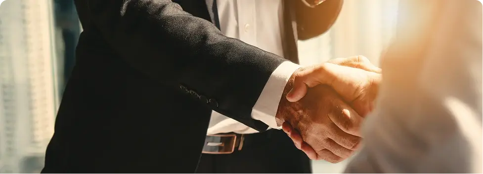 Two people shaking hands.